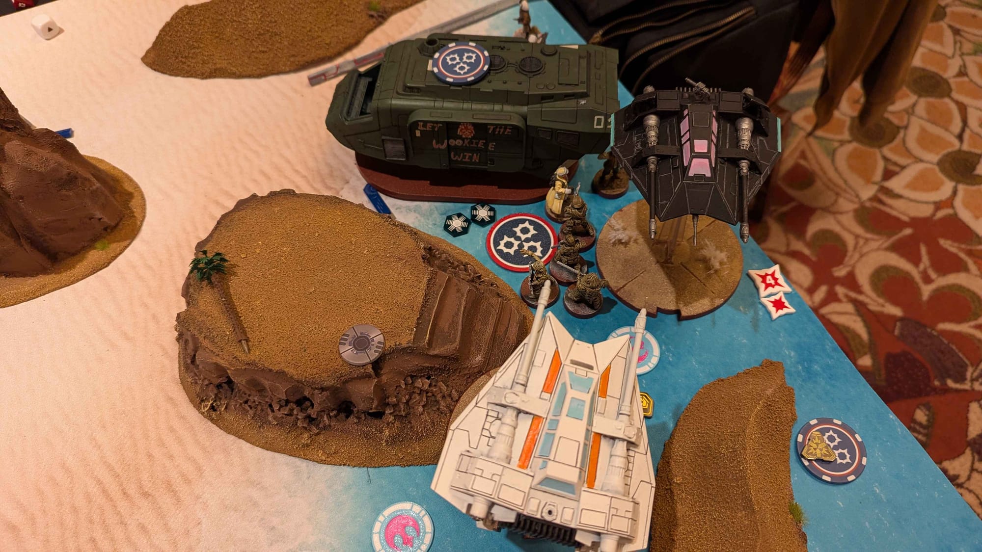 Photo of a game of Star Wars Legion featuring two Rebel Airspeeders in a Miami Vice theme.